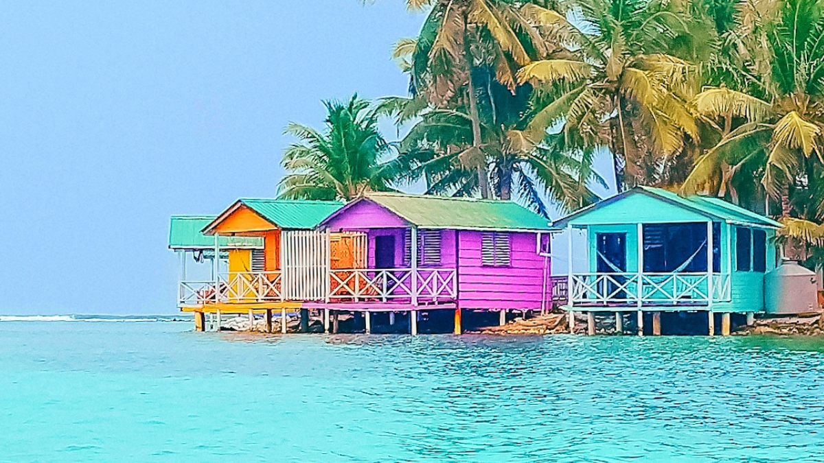 tobacco caye resorts The $90/night Overwater Bungalow You Need to Add To Your Bucket List –  CHASE THE RAINBOWS