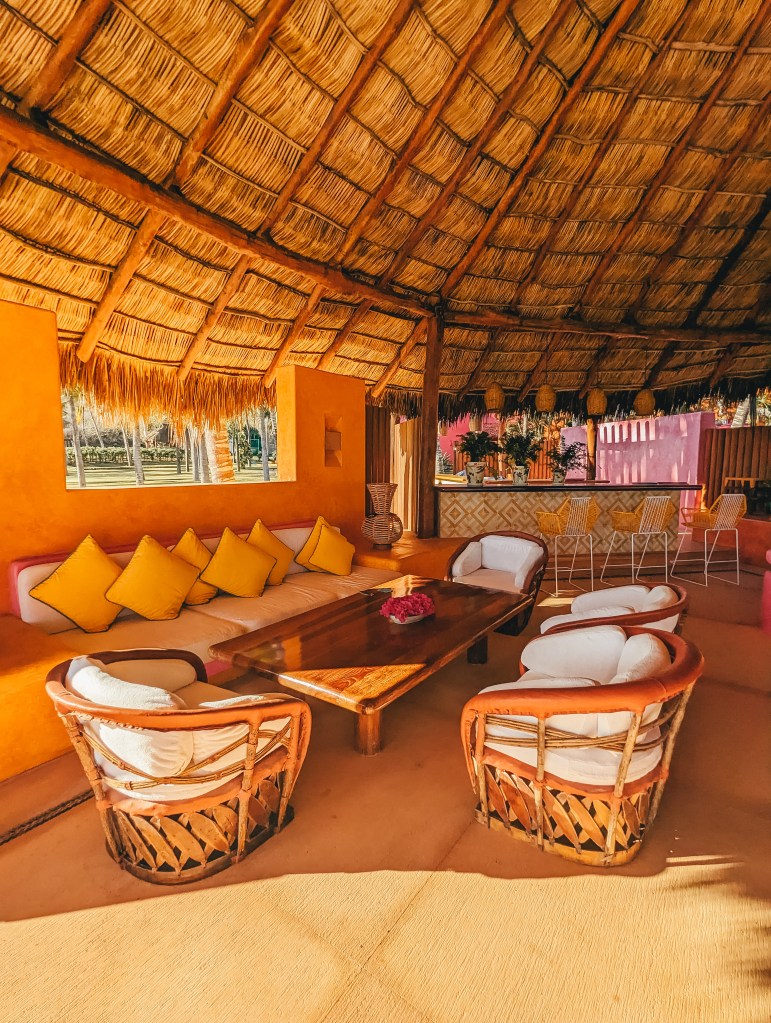 seating area la palapa beach club las alamandas mexico