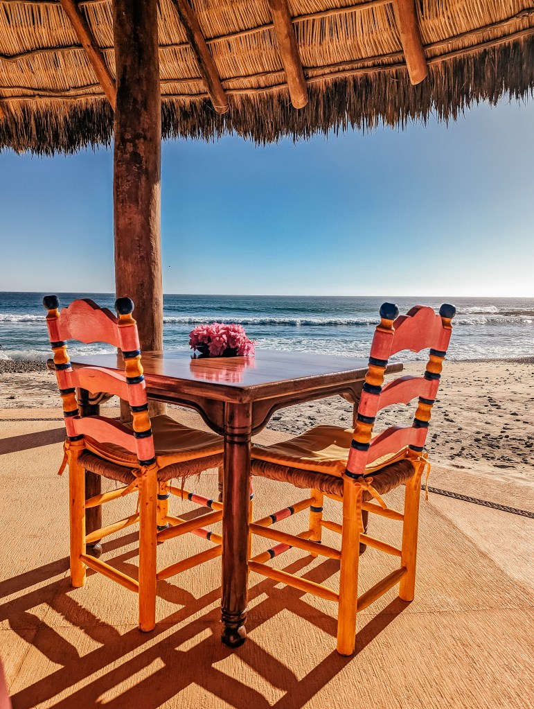 seating area palapa beach club las alamandas